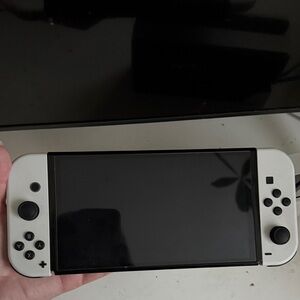 Nintendo Switch OLED
 White Handheld Gaming Console with Dual Analog Controls